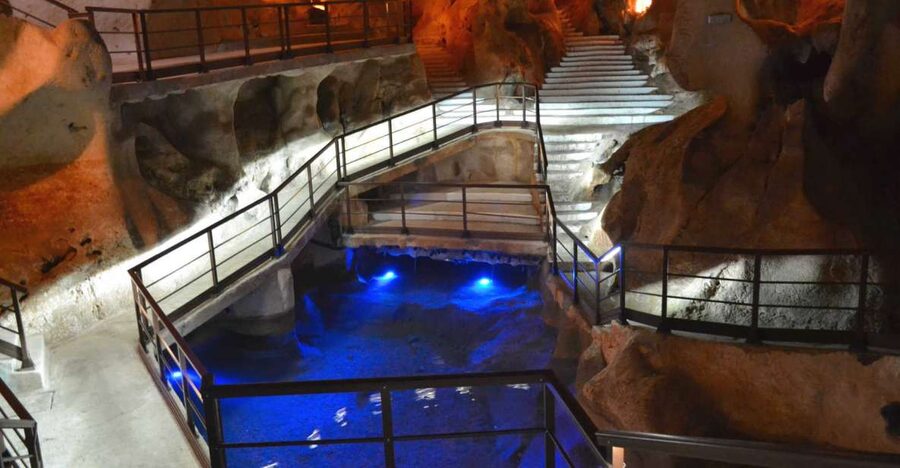 Explore Málaga and the Treasure Caves by Electric Car - A City Tour With a Steering Wheel