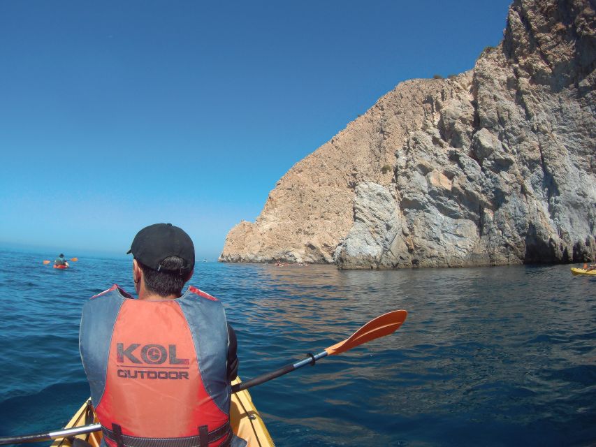 From Málaga: Cliffs of Maro-Cerro Gordo Guided Kayaking Tour - Looking up at the 250-meter cliffs