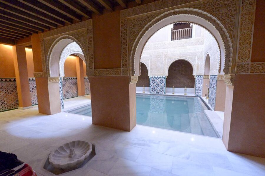 From Malaga: Hammam Bath, Kessa and Relaxing Massage Tour - The kessa scrub on heated stone