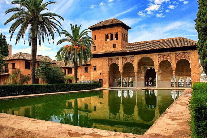 Granada Full Day Tour From Malaga - Carlos V Palace and the layered story of Granada