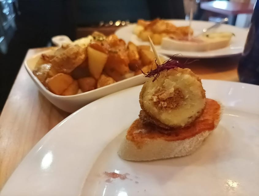 Malaga: Food Tour with Local Guide, Tapas, and Drinks - Meatballs, carrillada, and chivo malagueño