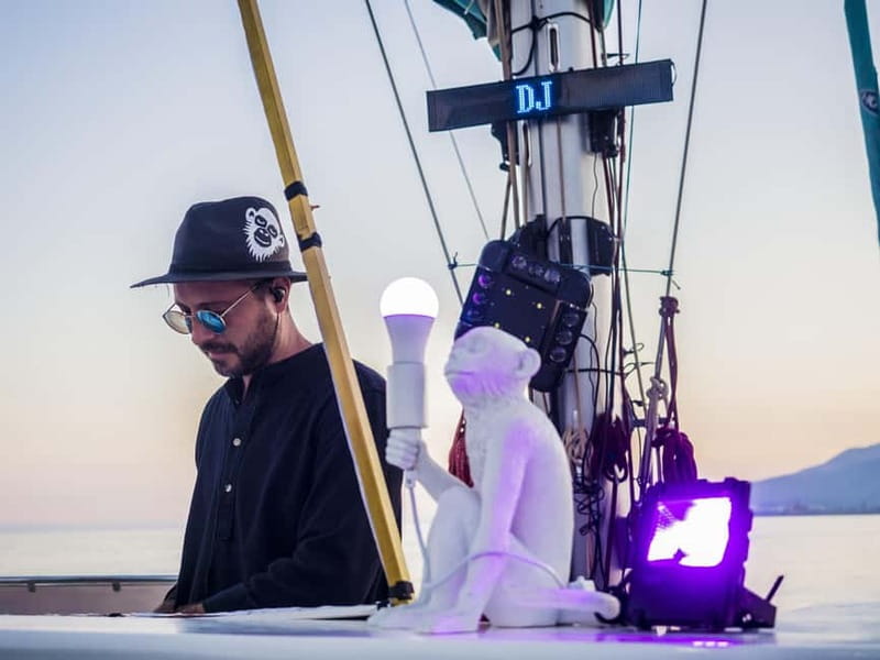 Malaga: Sailing Catamaran Sunset Cruise with Live DJ & Drink - Setting sail from Málaga Port