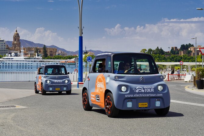 Málaga Sunset & Night Tour by Electric Car - Fishing districts beyond the postcard center