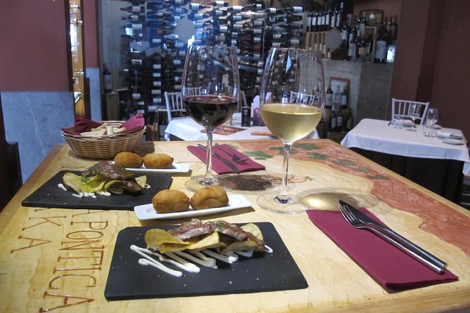 Malaga Wine & Tapas Small Group Guided Tour - Iberian ham at a traditional ultramarinos
