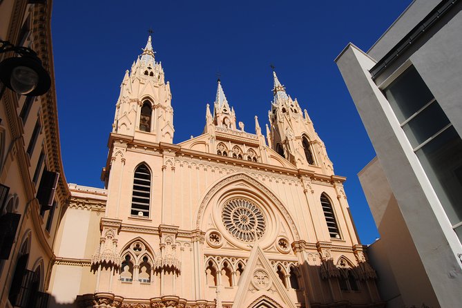 Secret Malaga Private Walking Tour - Returning to the Monumento a Larios